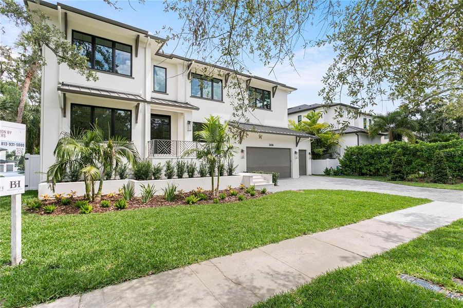 Front exterior of a new home in , Tampa, FL, highlighting curb appeal (Image 28). Front exterior of a new home in , Tampa, FL, highlighting curb appeal (Image 28).
