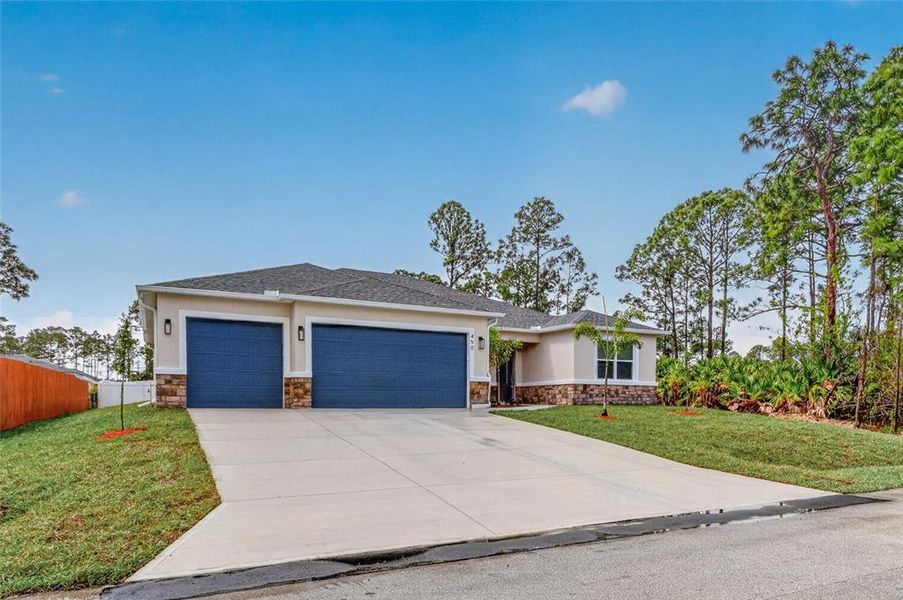 Front exterior of a new home in , Palm Bay, FL, highlighting curb appeal (Image 22).