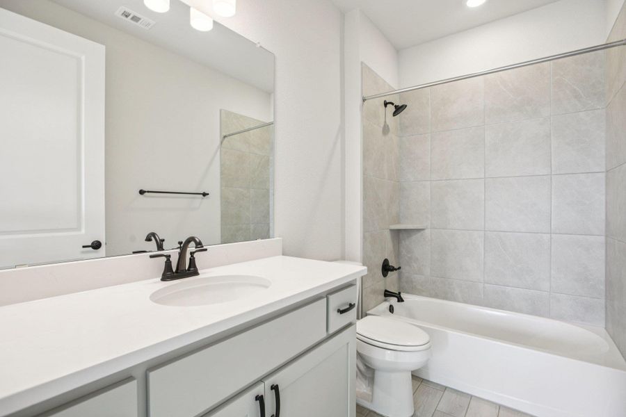 Full bathroom with vanity and bathtub / shower combination