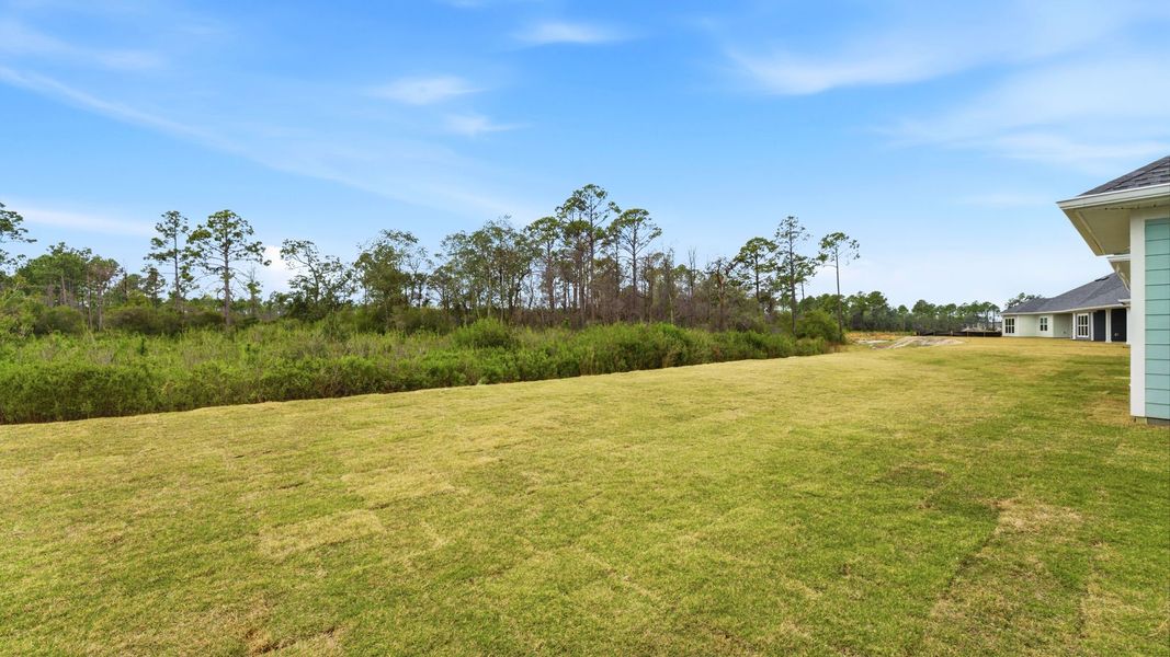 Exterior details and patio area of a home in Breakfast Point East Phase II, Panama City Beach (Image 23).