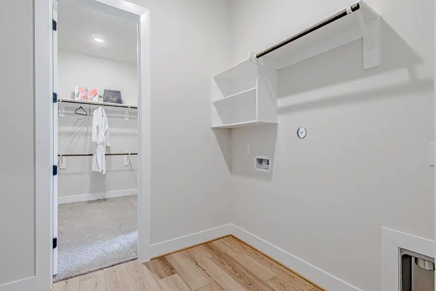 A unique layout connects the primary closet directly to the laundry room, adding ease to everyday living.