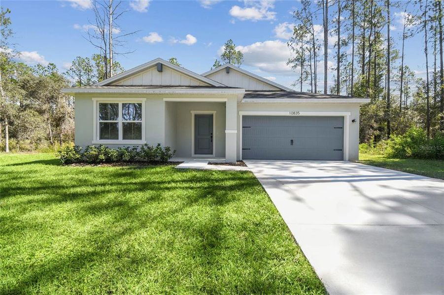 Front exterior of a new home in , Dunnellon, FL, highlighting curb appeal (Image 1). Front exterior of a new home in , Dunnellon, FL, highlighting curb appeal (Image 1).