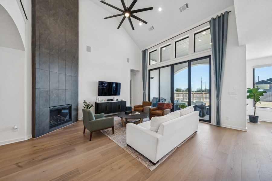 Complete with 2-story slate gas fireplace, commercial fan, black framed glass doors that fully open and extra windows for natural light.