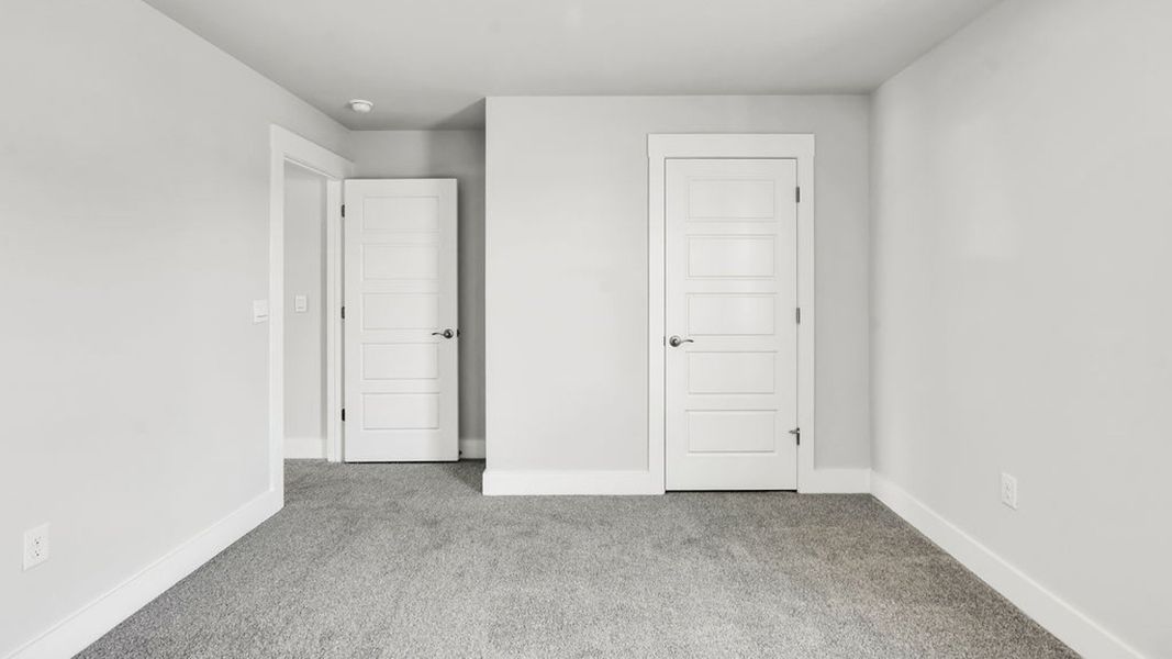 Spacious, unfurnished interior of a new home in Sidbury Station, Castle Hayne (Image 31).