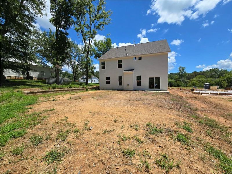 Exterior details and patio area of a home in Marble Tree, Ball Ground (Image 2).