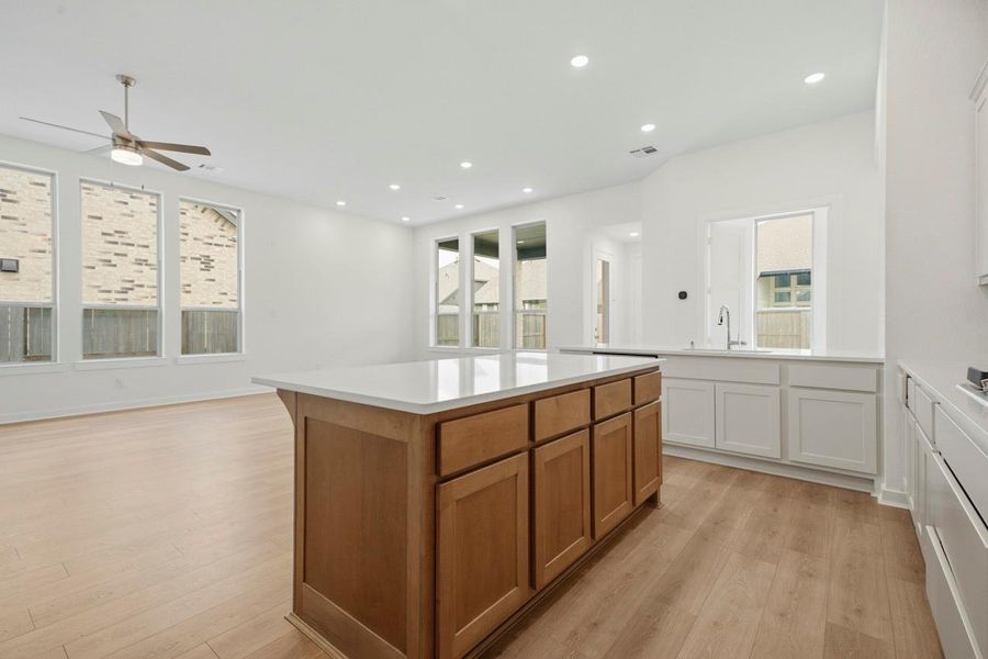 Kitchen island separat from kitchen bar and sink, gives a clear working/serving space. Kitchen island separat from kitchen bar and sink, gives a clear working/serving space.
