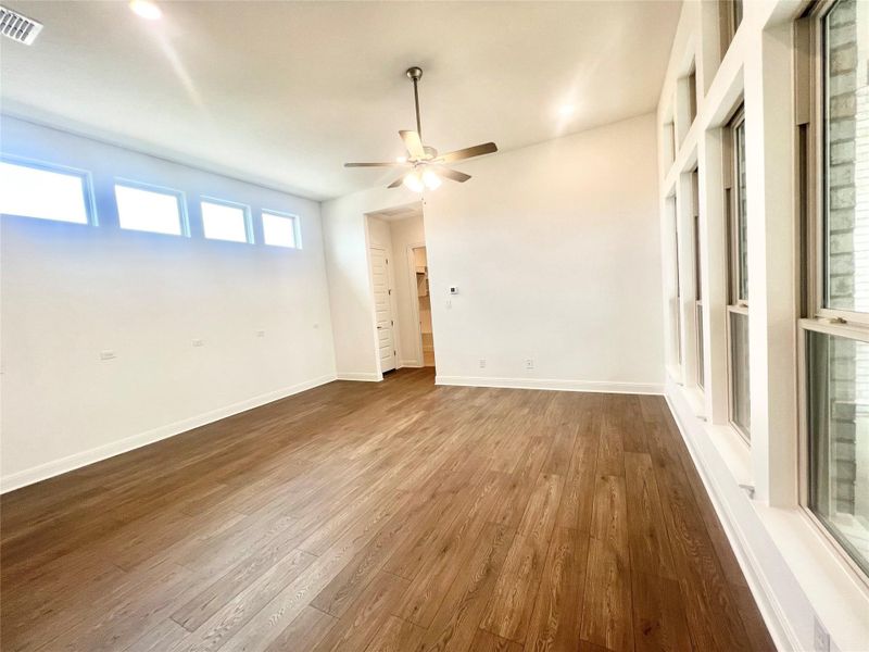 Spare room with dark wood finished floors and ceiling fan Spare room with dark wood finished floors and ceiling fan