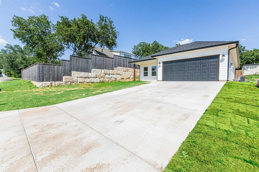 Front exterior of a new home in , West, TX, highlighting curb appeal (Image 2).