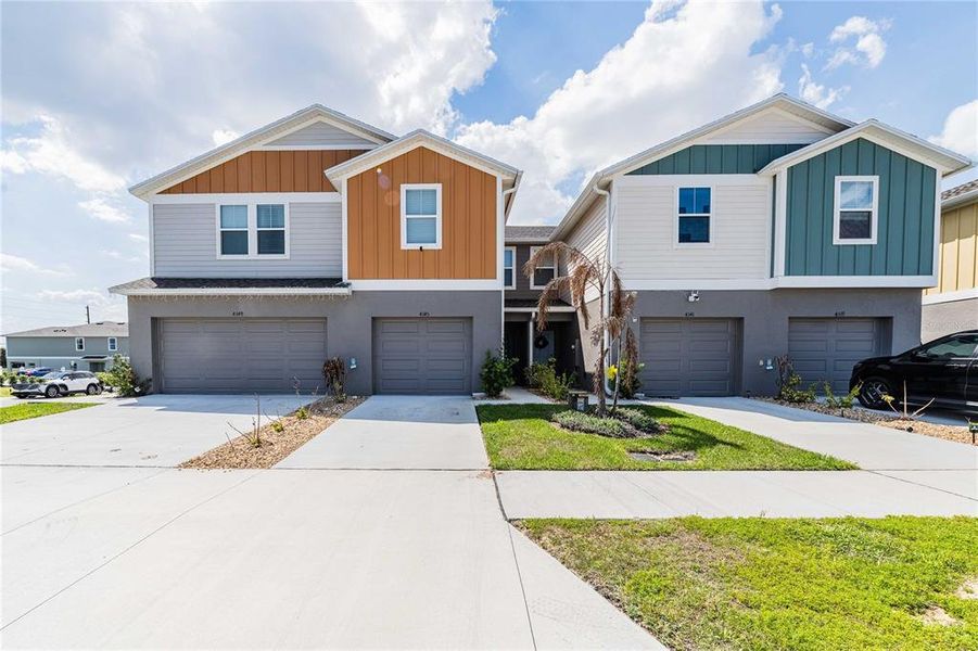 Front exterior of a new home in , Haines City, FL, highlighting curb appeal (Image 1). Front exterior of a new home in , Haines City, FL, highlighting curb appeal (Image 1).