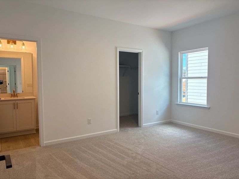 Primary Bed featuring the AW Collection® Serene - A tranquil retreat in soft, neutral textures.