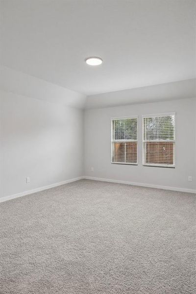 Primary Suite in the Heisman home plan by Trophy Signature Homes – REPRESENTATIVE PHOTO