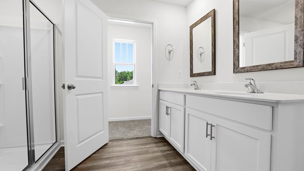 Furnished interior view inside a new home in Bentley Park, Greenwood (Image 10).