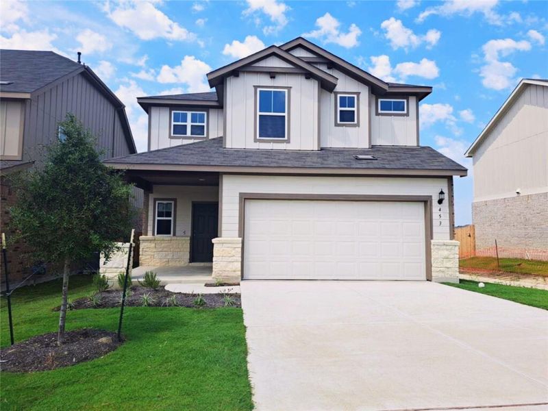 Front exterior of a new home in Sunfield, Buda, TX, highlighting curb appeal (Image 2). Front exterior of a new home in Sunfield, Buda, TX, highlighting curb appeal (Image 2).