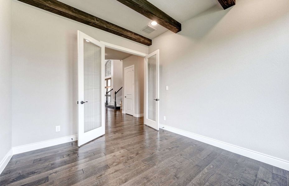 Representative unfurnished interior of a home built from the 4590 by Ravenna Homes in Artavia 70′, Conroe (Image 24).