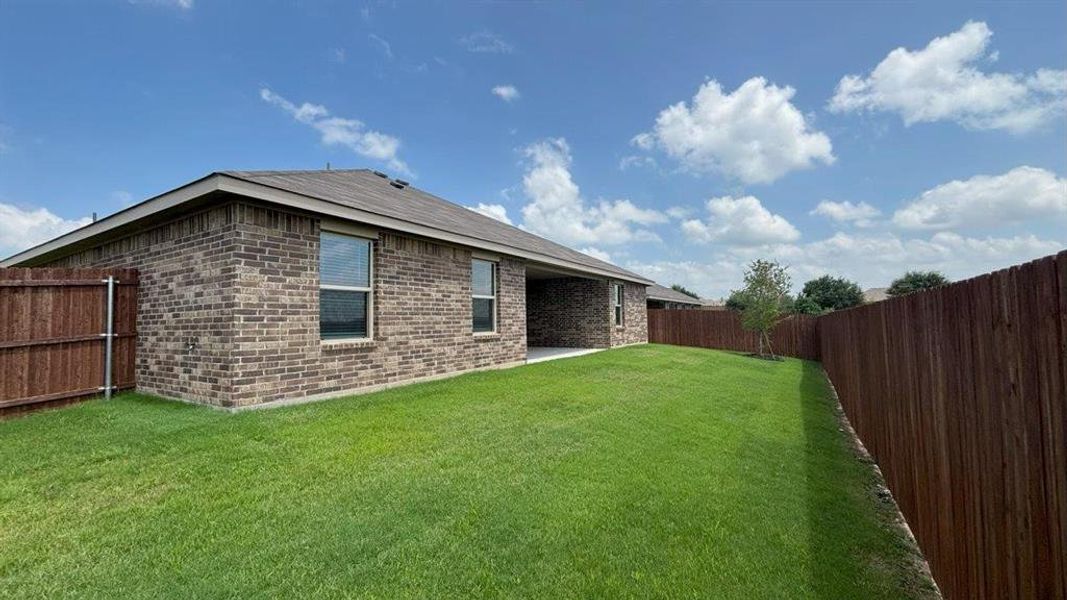 Front exterior of a new home in Legado, Cleburne, TX, highlighting curb appeal (Image 14).