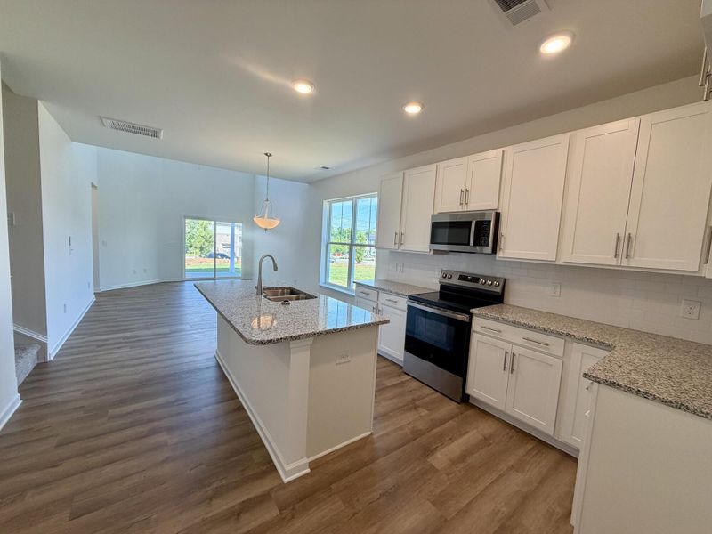 Furnished interior view inside a new home in Bellevue Townhomes, Greenville (Image 6).