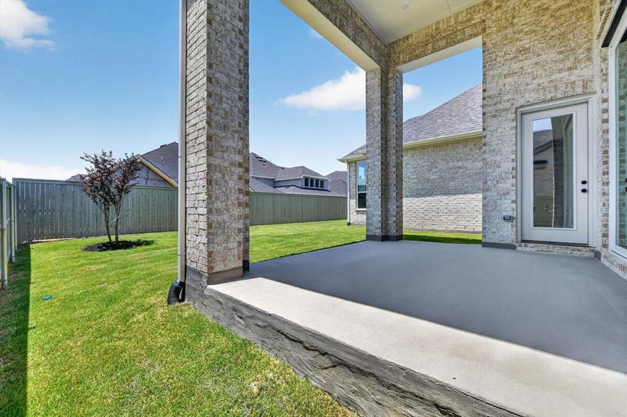 Exterior details and patio area of a home in Pecan Square, Northlake (Image 2).