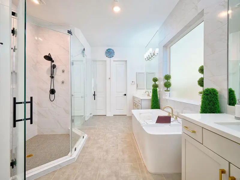 Indulge in a spa-like retreat with dual sinks, an oversized walk-in shower, and a luxurious soaking tub with jacuzzi.