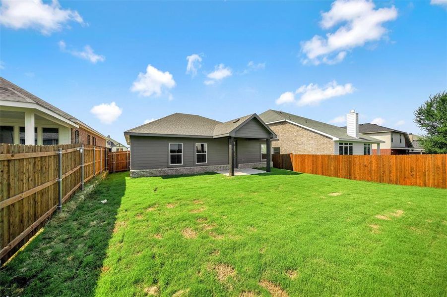 Front exterior of a new home in Liberty Pointe, Gainesville, TX, highlighting curb appeal (Image 24). Front exterior of a new home in Liberty Pointe, Gainesville, TX, highlighting curb appeal (Image 24).