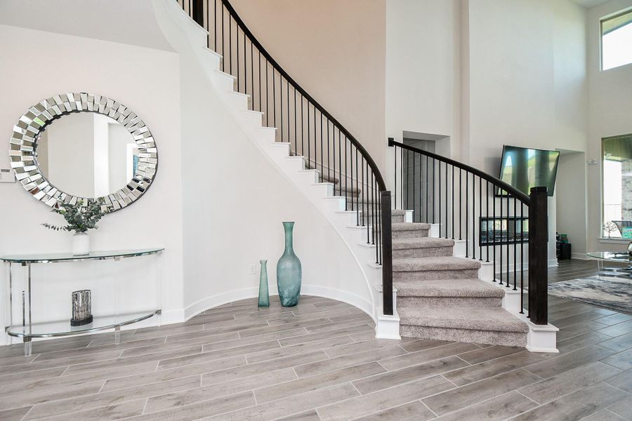 The extended front entry/hallway offers wall and floor space for gorgeous accents. The extended front entry/hallway offers wall and floor space for gorgeous accents.