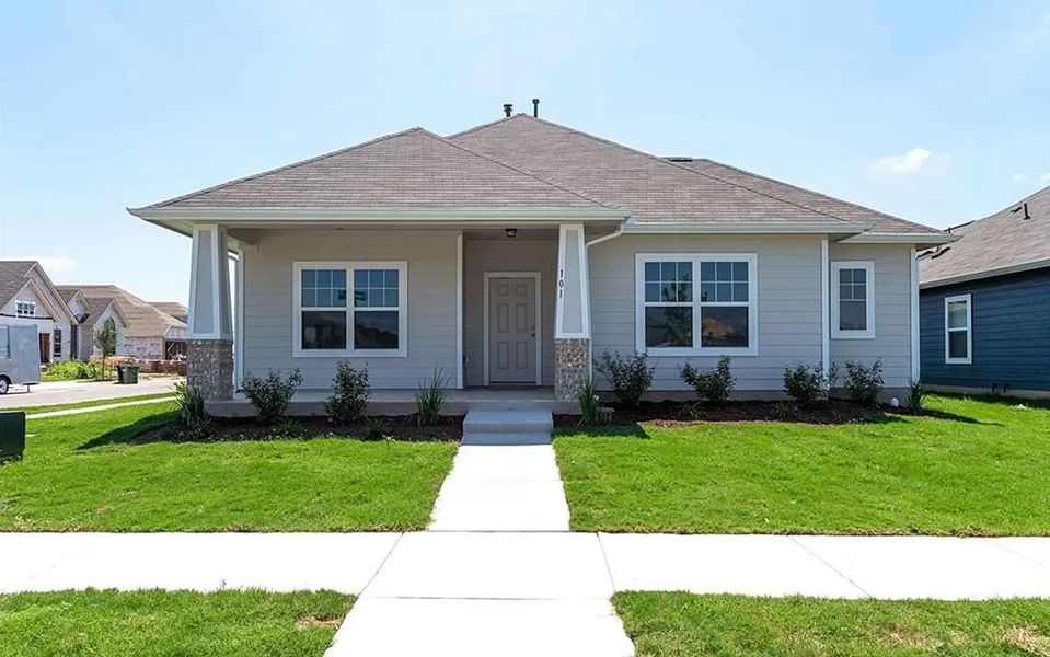 Front exterior of a new home in Brooklands, Hutto, TX, highlighting curb appeal (Image 2).
