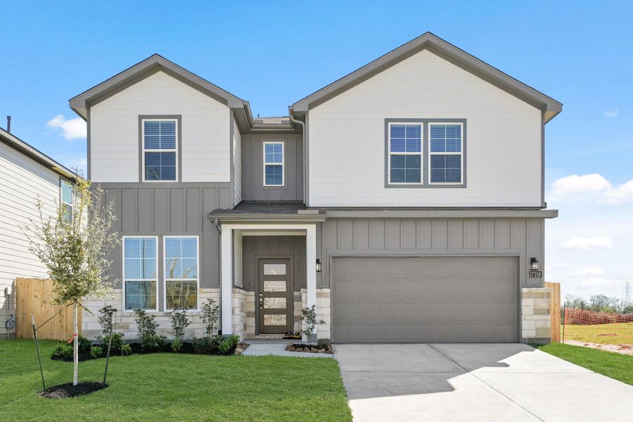 Front exterior of a new home in Paloma at Sanford Farms, Waller, TX, highlighting curb appeal (Image 2). Front exterior of a new home in Paloma at Sanford Farms, Waller, TX, highlighting curb appeal (Image 2).