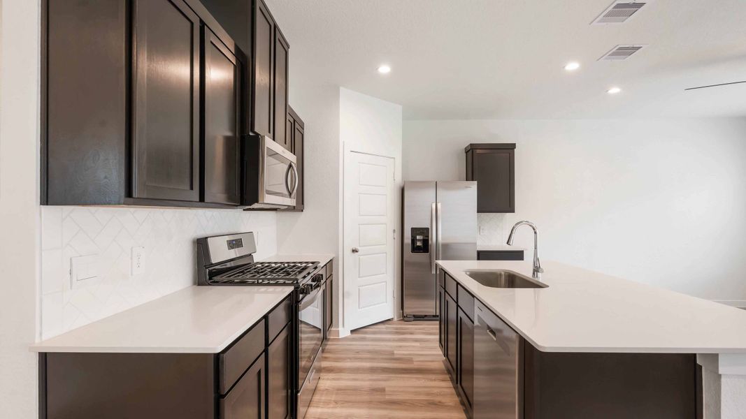 Representative furnished interior of a home built from the Iris by D.R. Horton in City Gate North, Houston (Image 5).