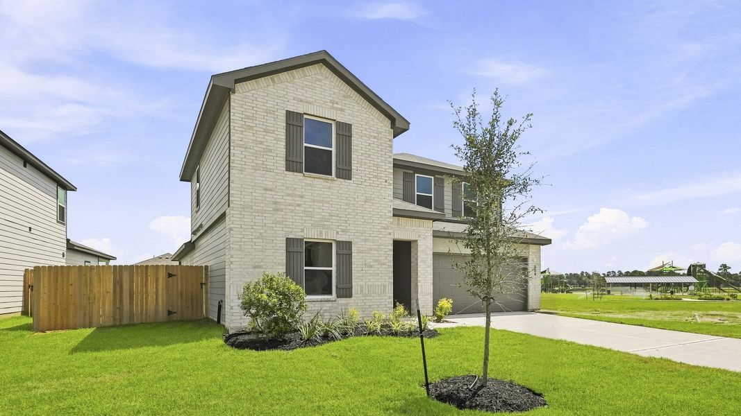 Front exterior of a new home in Maple Woods, Hockley, TX, highlighting curb appeal (Image 20). Front exterior of a new home in Maple Woods, Hockley, TX, highlighting curb appeal (Image 20).