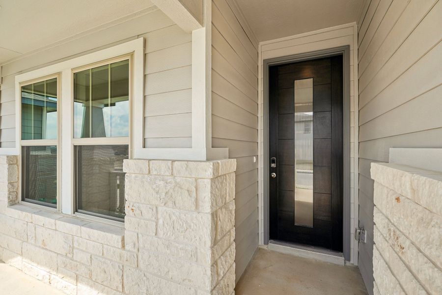 The front exterior of the Allen floorplan at a Meritage Homes community.