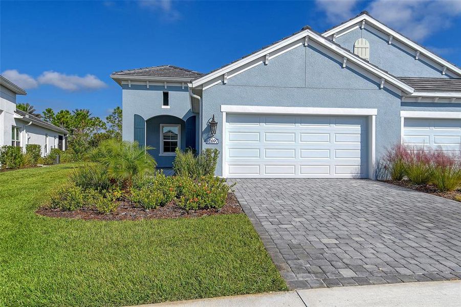 Front exterior of a new home in , Venice, FL, highlighting curb appeal (Image 2). Front exterior of a new home in , Venice, FL, highlighting curb appeal (Image 2).