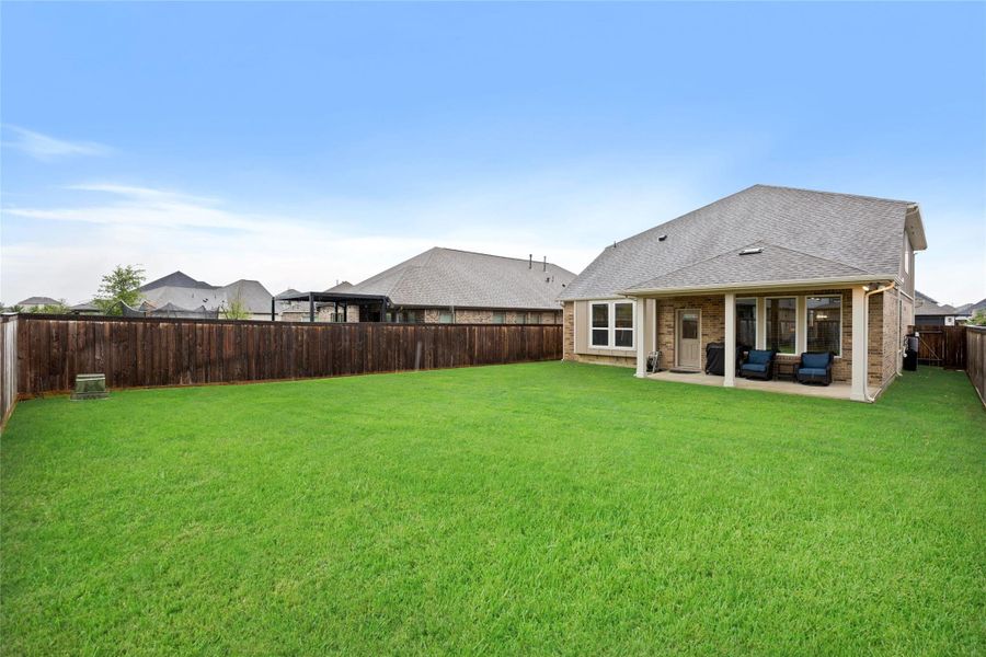The backyard offers the perfect blend of beauty, privacy, and functionality. The backyard offers the perfect blend of beauty, privacy, and functionality.