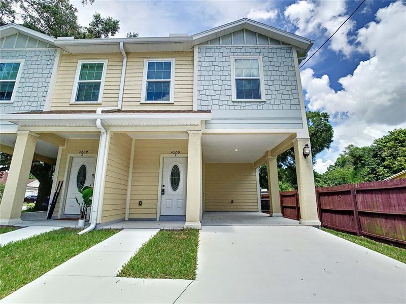 Front exterior of a new home in , Tampa, FL, highlighting curb appeal (Image 2).