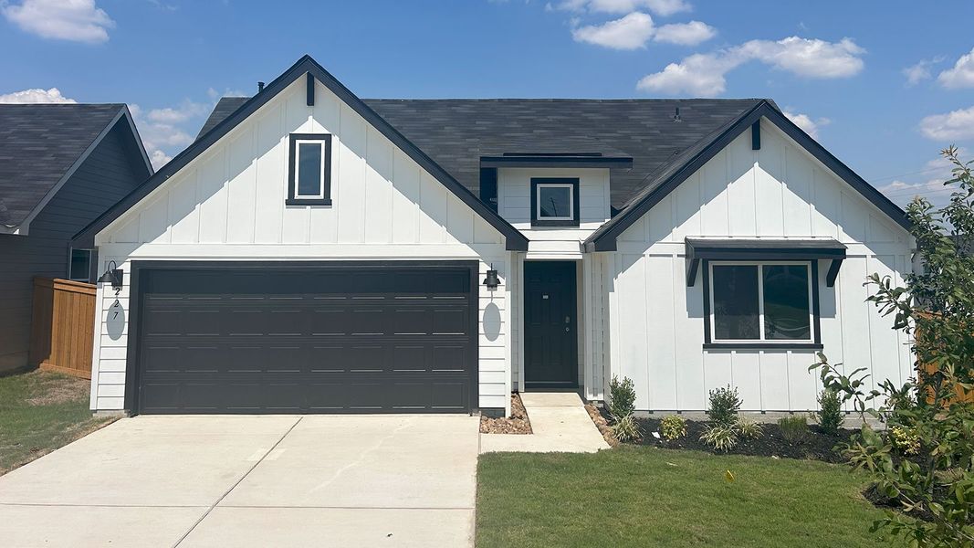 Front exterior of a new home in Trace, San Marcos, TX, highlighting curb appeal (Image 1). Front exterior of a new home in Trace, San Marcos, TX, highlighting curb appeal (Image 1).