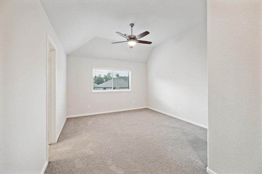 Third upstairs bedroom with ensuite features a closet that has access to a Texas basement.