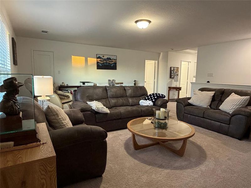 Three Generously Sized Bedrooms and Two Additional Full Baths Down Hall to the Right