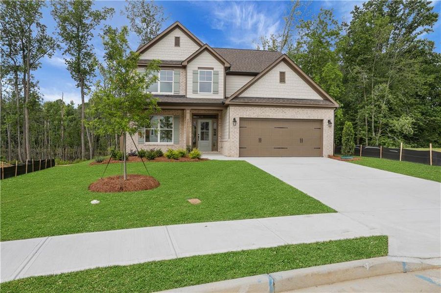 Front exterior of a new home in , Loganville, GA, highlighting curb appeal (Image 2). Front exterior of a new home in , Loganville, GA, highlighting curb appeal (Image 2).