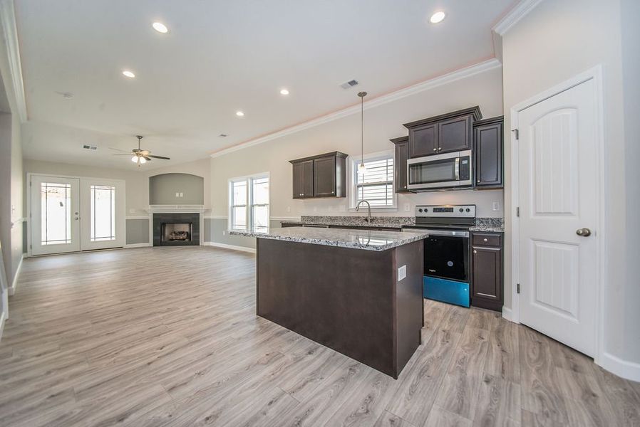 Representative furnished interior of a home built from the Quincy by Enchanted Homes in Lonesome Dove, San Antonio (Image 12).