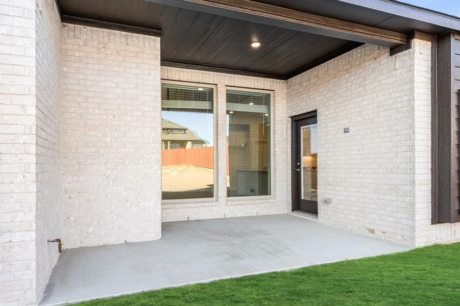 Exterior details and patio area of a home in The Lakes at Parks of Aledo, Aledo (Image 4).