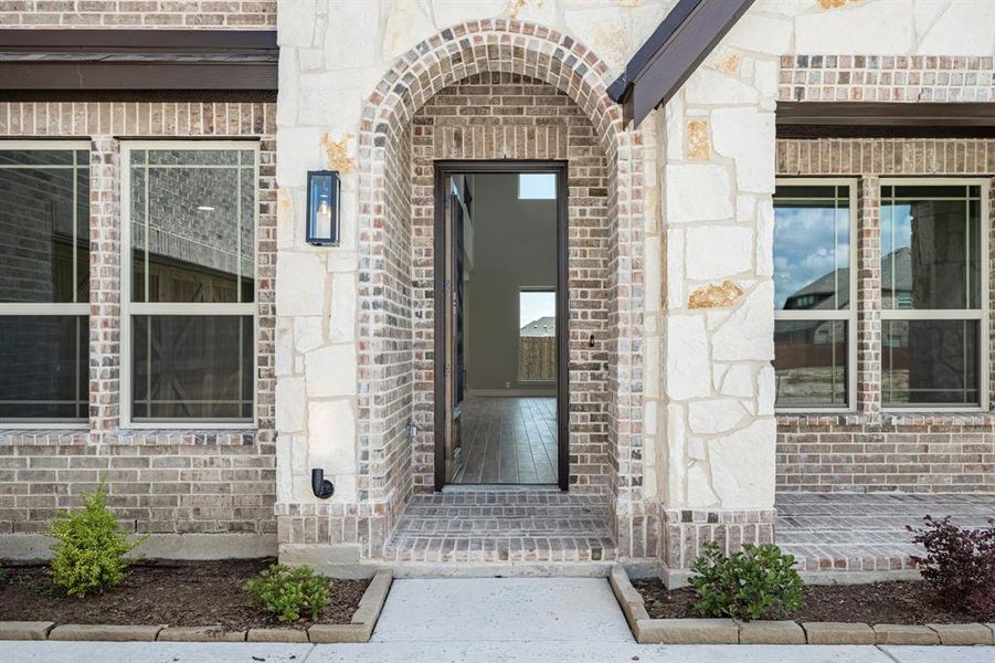 Front exterior of a new home in The Oaks, Red Oak, TX, highlighting curb appeal (Image 1). Front exterior of a new home in The Oaks, Red Oak, TX, highlighting curb appeal (Image 1).