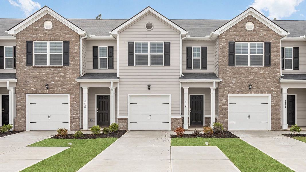 Front exterior of a new home in Laurel Park Townhomes, Hephzibah, GA, highlighting curb appeal (Image 1). Front exterior of a new home in Laurel Park Townhomes, Hephzibah, GA, highlighting curb appeal (Image 1).