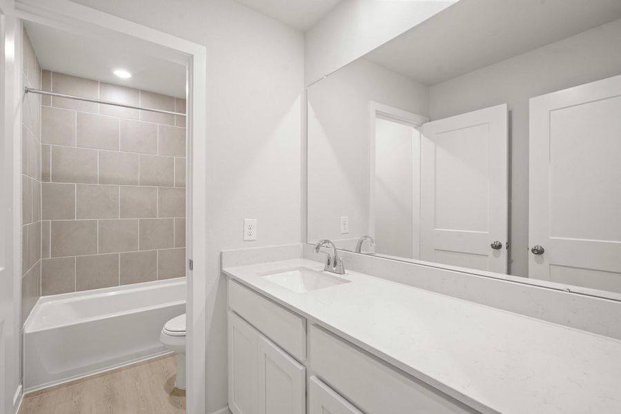 Furnished interior view inside a new home in Sunterra, Katy (Image 4).