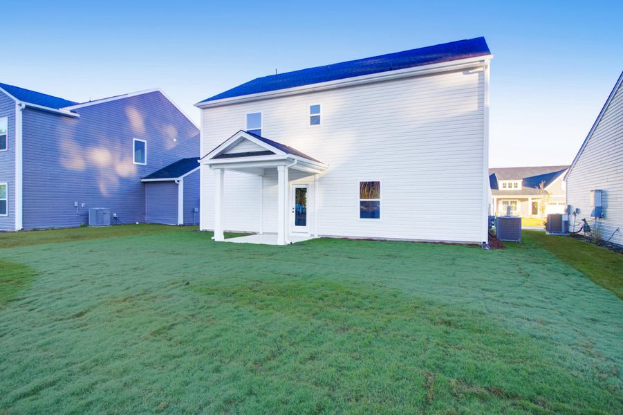 Exterior details and patio area of a home in , Ravenel (Image 3). Exterior details and patio area of a home in , Ravenel (Image 3).