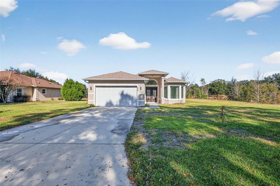 Front exterior of a new home in , Lady Lake, FL, highlighting curb appeal (Image 2). Front exterior of a new home in , Lady Lake, FL, highlighting curb appeal (Image 2).