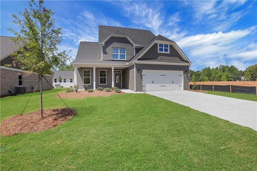 Front exterior of a new home in , Loganville, GA, highlighting curb appeal (Image 27). Front exterior of a new home in , Loganville, GA, highlighting curb appeal (Image 27).