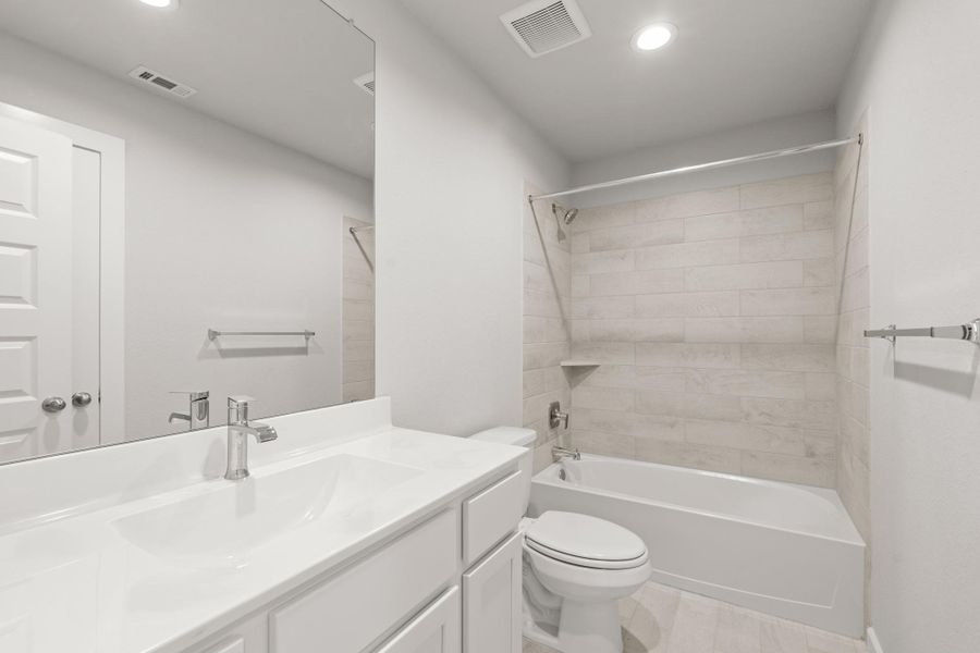 Furnished interior view inside a new home in Sunterra North, Katy (Image 11).