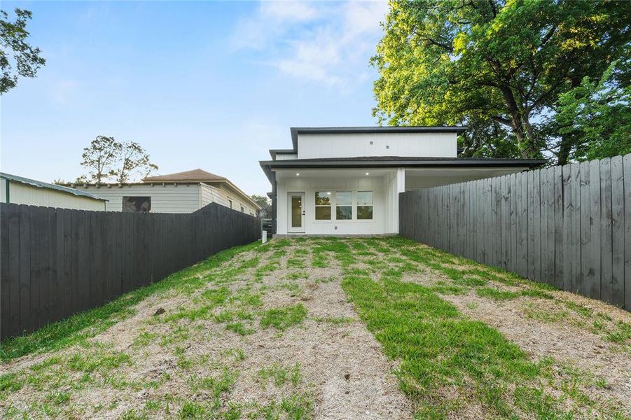 Back of property with a fenced backyard Back of property with a fenced backyard