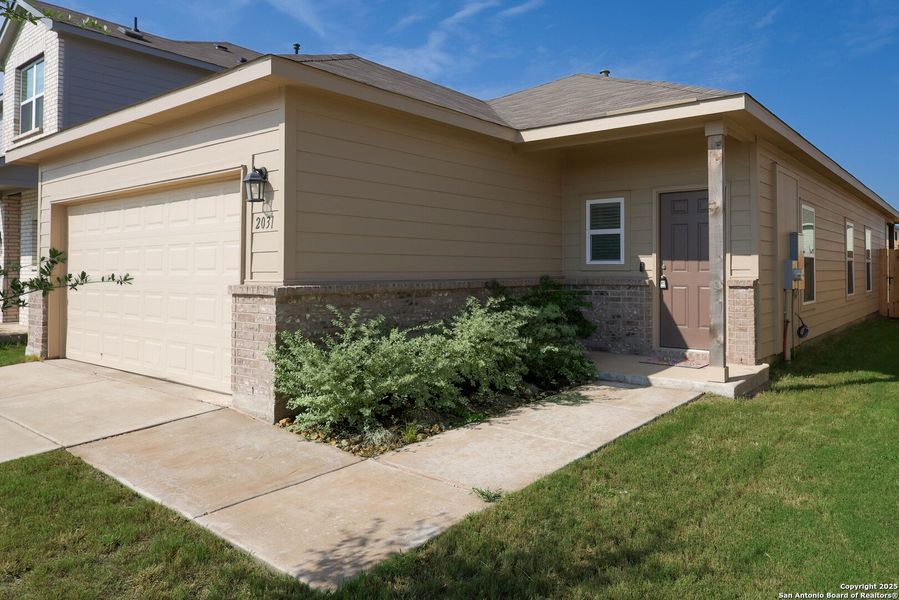 Front exterior of a new home in , Converse, TX, highlighting curb appeal (Image 2). Front exterior of a new home in , Converse, TX, highlighting curb appeal (Image 2).
