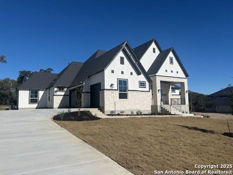 Front exterior of a new home in Heimer Estates at Garden Ridge, San Antonio, TX, highlighting curb appeal (Image 2).