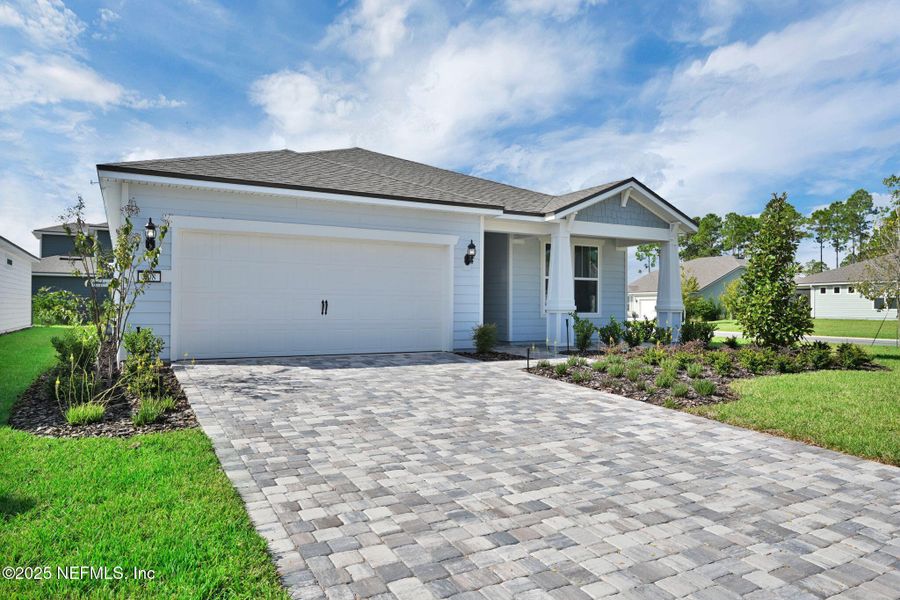 Front exterior of a new home in Del Webb Nocatee, Ponte Vedra, FL, highlighting curb appeal (Image 1).