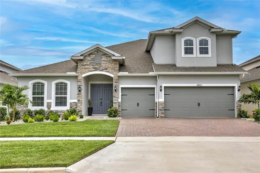Front exterior of a new home in , Clermont, FL, highlighting curb appeal (Image 2). Front exterior of a new home in , Clermont, FL, highlighting curb appeal (Image 2).